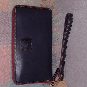 Dooney and Bourke Large zip around wallet in Navy Florentine leather